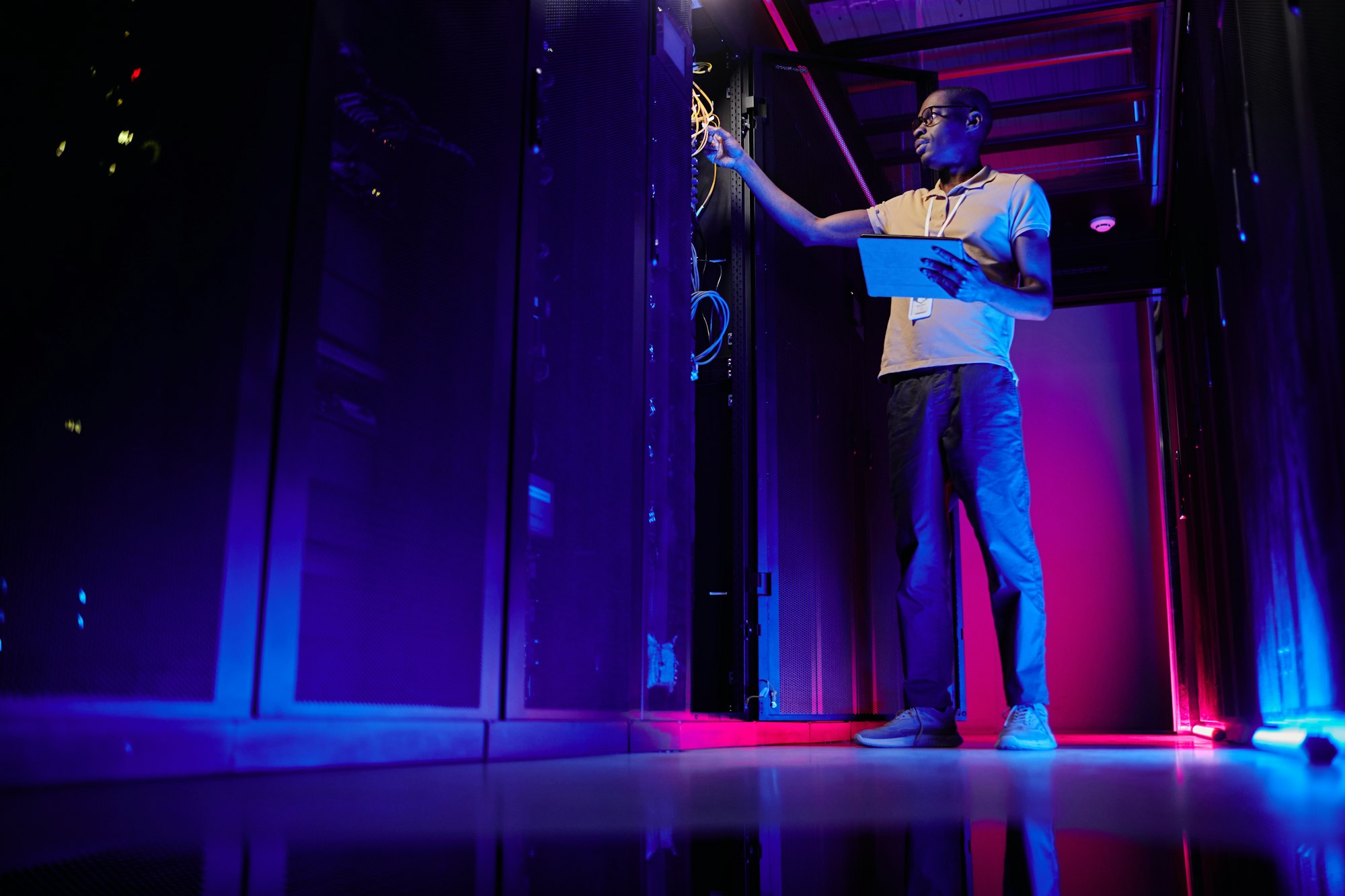 Technician in Neon Server Room